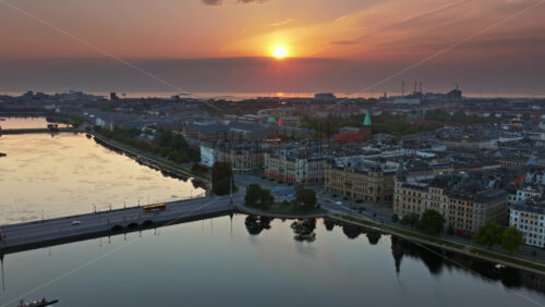 Video - Aerial drone view of Dronning Louises Bridge crossing The Lakes at sunrise in Copenhagen, Denmark