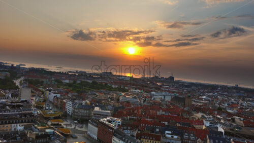 Video - Aerial drone view over Osterbro and Norrebro neighborhoods with morning sun in Copenhagen, Denmark