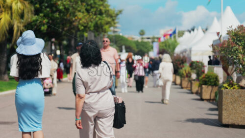 Video - Cannes, France - May 13, 2025: People walking on the streets of the city in daylight