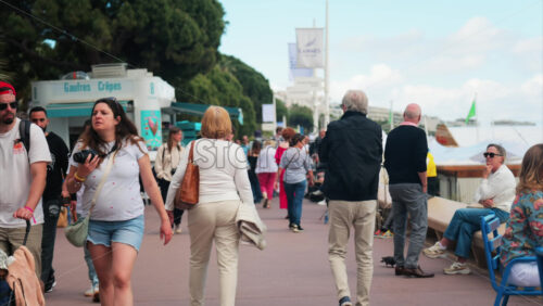 Video - Cannes, France - May 13, 2025: People walking on the streets of the city in daylight