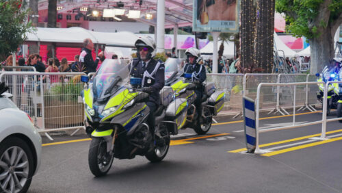 Video - Cannes, France - May 13, 2025: Policemen on motorcycles on the street at the Cannes Film Festival