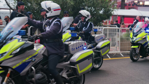 Video - Cannes, France - May 13, 2025: Policemen on motorcycles on the street at the Cannes Film Festival
