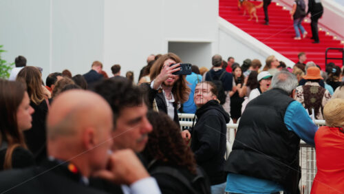 Video - Cannes, France - May 13, 2025: People watching celebrities walking on the red carpet at the Cannes Film Festival