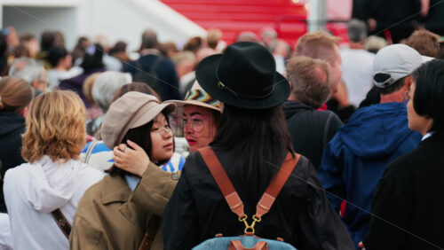 Video - Cannes, France - May 13, 2025: People waiting for celebrities near the red carpet at the Cannes Film Festival