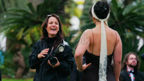 Video - Cannes, France - May 13, 2025: People taking pictures in the Palace of Festivals gardens at the Cannes Film Festival