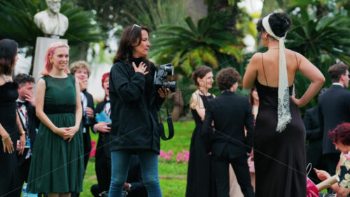 Video - Cannes, France - May 13, 2025: People taking pictures in the Palace of Festivals gardens at the Cannes Film Festival