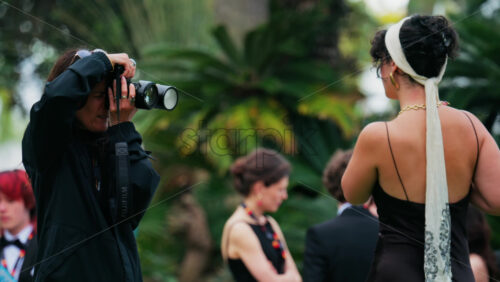 Video - Cannes, France - May 13, 2025: People taking pictures in the Palace of Festivals gardens at the Cannes Film Festival