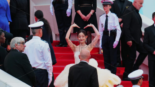 Video - Cannes, France - May 13, 2025: Qianhui Wan posing for photographers on the red carpet at the Cannes Film Festival