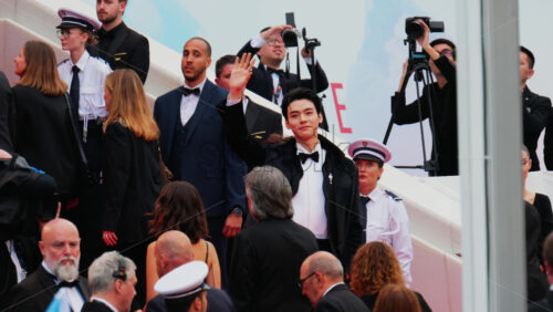 Video - Cannes, France - May 13, 2025: Gong Jun waving on the red carpet at the Cannes Film Festival