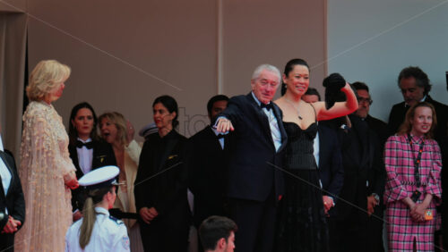 Video - Cannes, France - May 13, 2025: Robert De Niro and Tiffany Chen waving on the red carpet at the Cannes Film Festival