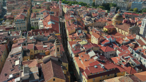 Video - Aerial drone view of Nice Old Town with narrow streets, terracotta rooftops, and historic buildings