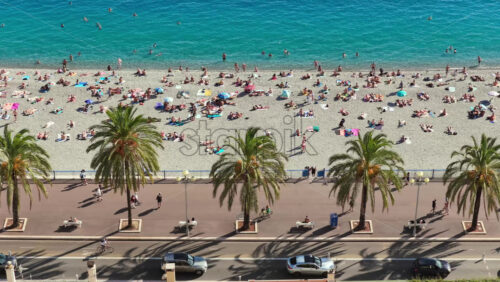 Video - Aerial drone view of the famous waterfall at Castle Hill in Nice, surrounded by lush trees and scenic viewpoints