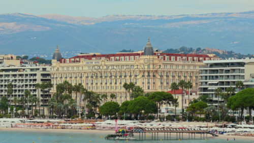 Video - Cannes, France - September 6, 2025: Aerial drone view of the Carlton Hotel on La Croisette, Cannes, with beach clubs and Mediterranean seaside