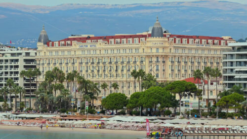 Video - Cannes, France - September 6, 2025: Aerial drone view of the Carlton Hotel on La Croisette, Cannes, with beach clubs and Mediterranean seaside