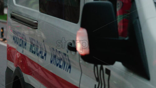 Video - Chisinau, Moldova - October 1, 2025: Close up shot of an ambulance vehicle with emergency markings moving on the streets of the city