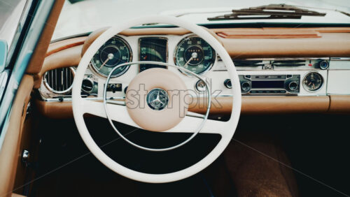 Video - Cannes, France - October 13, 2025: Close up view of a classic Mercedes convertible car interior with beige leather seats and chrome dashboard details