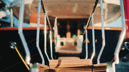 Video - Low angle close up of a yacht gangway leading onboard, with polished chrome handrails and soft golden light