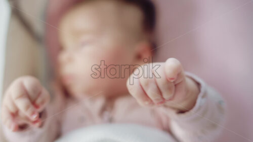 Video - Baby reaching out with tiny fingers in dreamy soft focus