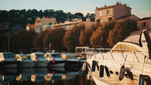 Video - Close up of a white yacht reflecting sunlight on calm water
