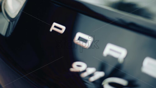 Video - Cannes, France - October 16, 2025: Close up of the rear of a Porsche 911 Carrera S luxury sports car with metallic reflections