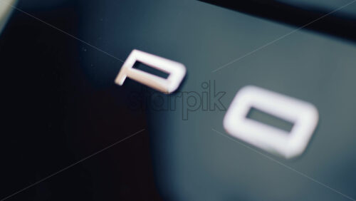 Video - Cannes, France - October 16, 2025: Close up of the rear of a Porsche 911 Carrera S luxury sports car with metallic reflections