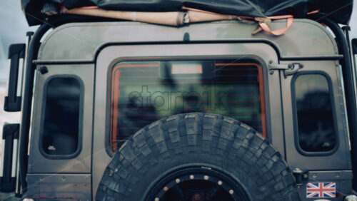 Video - Back view of an off road vehicle equipped with spare tire and roof tent