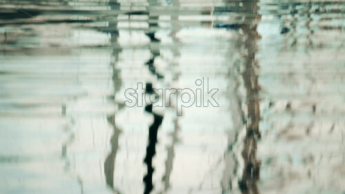 Video - Reflections of boats and masts rippling on the water