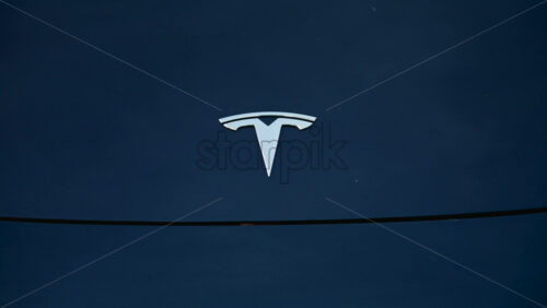 Video - Cannes, France - October 20, 2025: Cinematic close up of a Tesla car hood reflecting the silhouette of a tree at sunset