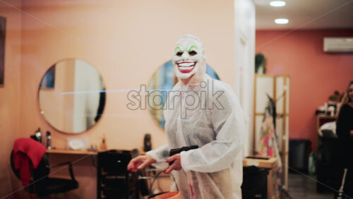 Video - Cannes, France - October 22, 2025: A cozy, peach toned salon interior is filled with life by clients