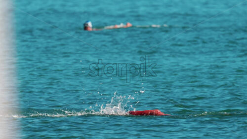 Video - Man swimming freestyle in the calm turquoise water off the coast of Cannes, France