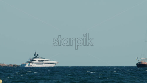 Video - Elegant white yacht cruising on the deep blue sea off the coast of Cannes, France