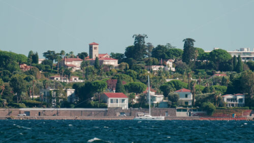 Video - Cannes, France - October 6, 2025: Scenic view of luxury villas and Mediterranean gardens on the hills near the sea