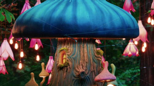 Video - Colorful fantasy style mushroom installation with glowing lights and decorative flower lamps in a forest setting