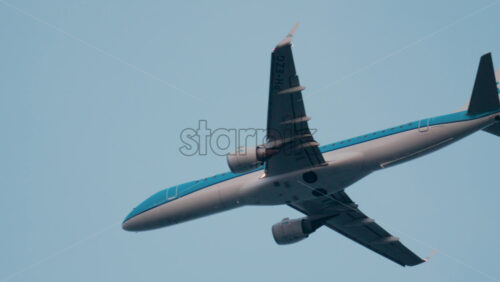 Video - Cannes, France - October 9, 2025: A passenger jet soars high in the sky with light clouds in the background