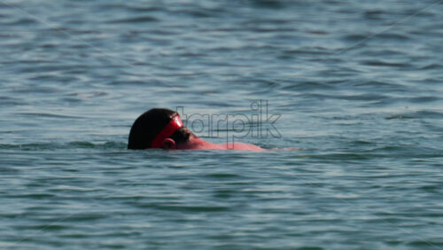 Video - Man wearing red goggles swimming in the Mediterranean sea
