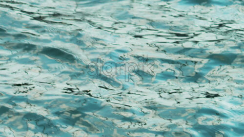 Video - The surface of calm sea water, sparkling in the sun
