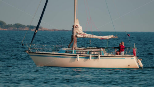Video - Cannes, France - October 11, 2025: A modern white yacht cruises smoothly across the blue sea under clear skies