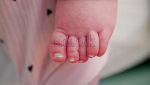 Video - Close up of a baby's small toes and skin texture, highlighting purity and natural details