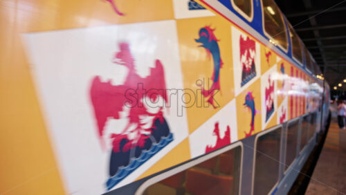 Video - Cannes, France - October 12, 2025: Two blue regional trains moving side by side under a station roof