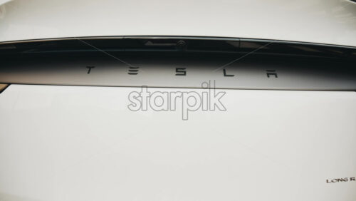 Video - Cannes, France - October 13, 2025: Close up of Tesla logo on the rear of a white electric car