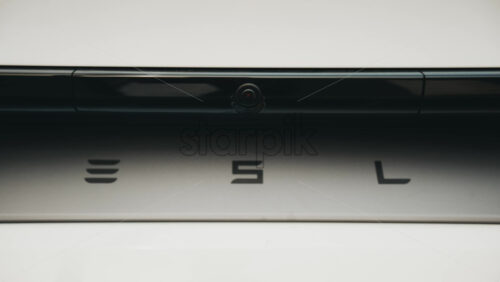 Video - Cannes, France - October 13, 2025: Close up of Tesla logo on the rear of a white electric car