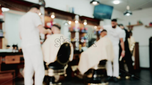 Video - Close up of chrome railing and wooden deck of a luxury yacht docked in a marina under golden light