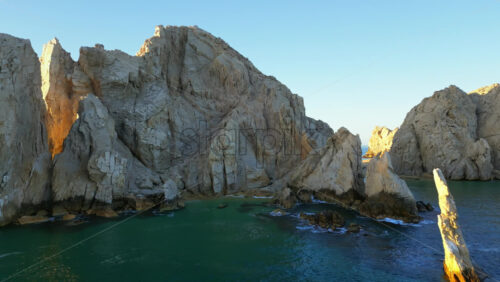 Video - Aerial drone view of El Arco de Cabo San Lucas, the iconic rock formation at Land's End in Baja California, Mexico