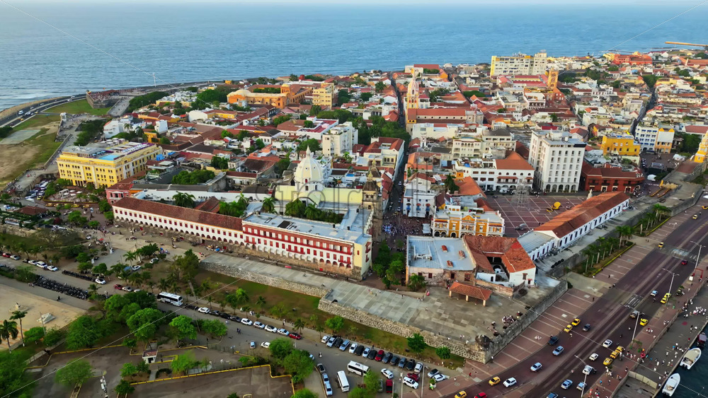 Video - Aerial drone view of Cartagena's famous walled city, highlighting its colonial architecture, domed cathedral, and historic streets by the Caribbean Sea