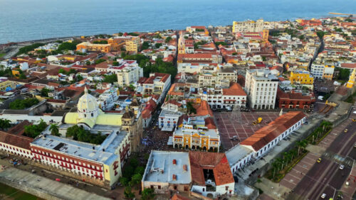 Video - Aerial drone view of Cartagena's famous walled city, highlighting its colonial architecture, domed cathedral, and historic streets by the Caribbean Sea
