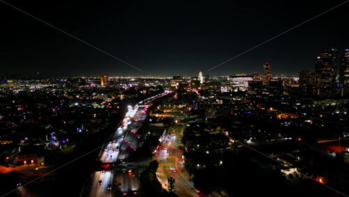 Video - Aerial drone view of downtown Los Angeles illuminated at night