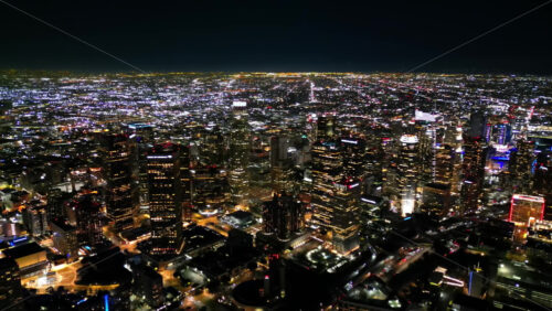 Video - Aerial drone view of Los Angeles at night, featuring endless city lights stretching to the horizon