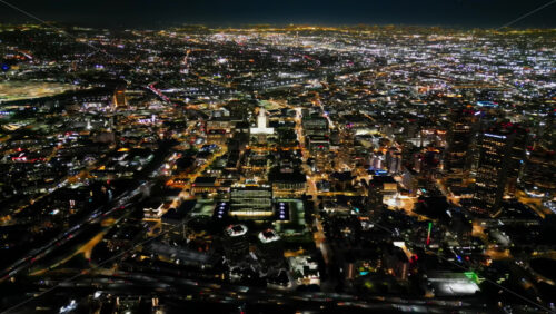 Video - Aerial drone view of the Griffith Observatory overlooking the illuminated skyline of Los Angeles at night