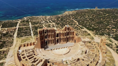 Video - Aerial drone view of the Roman Theatre of Sabratha, one of Libya's most iconic archaeological sites