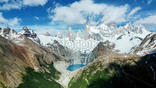 Video - Aerial drone view of the turquoise Laguna de los Tres with Mount Fitz Roy rising behind
